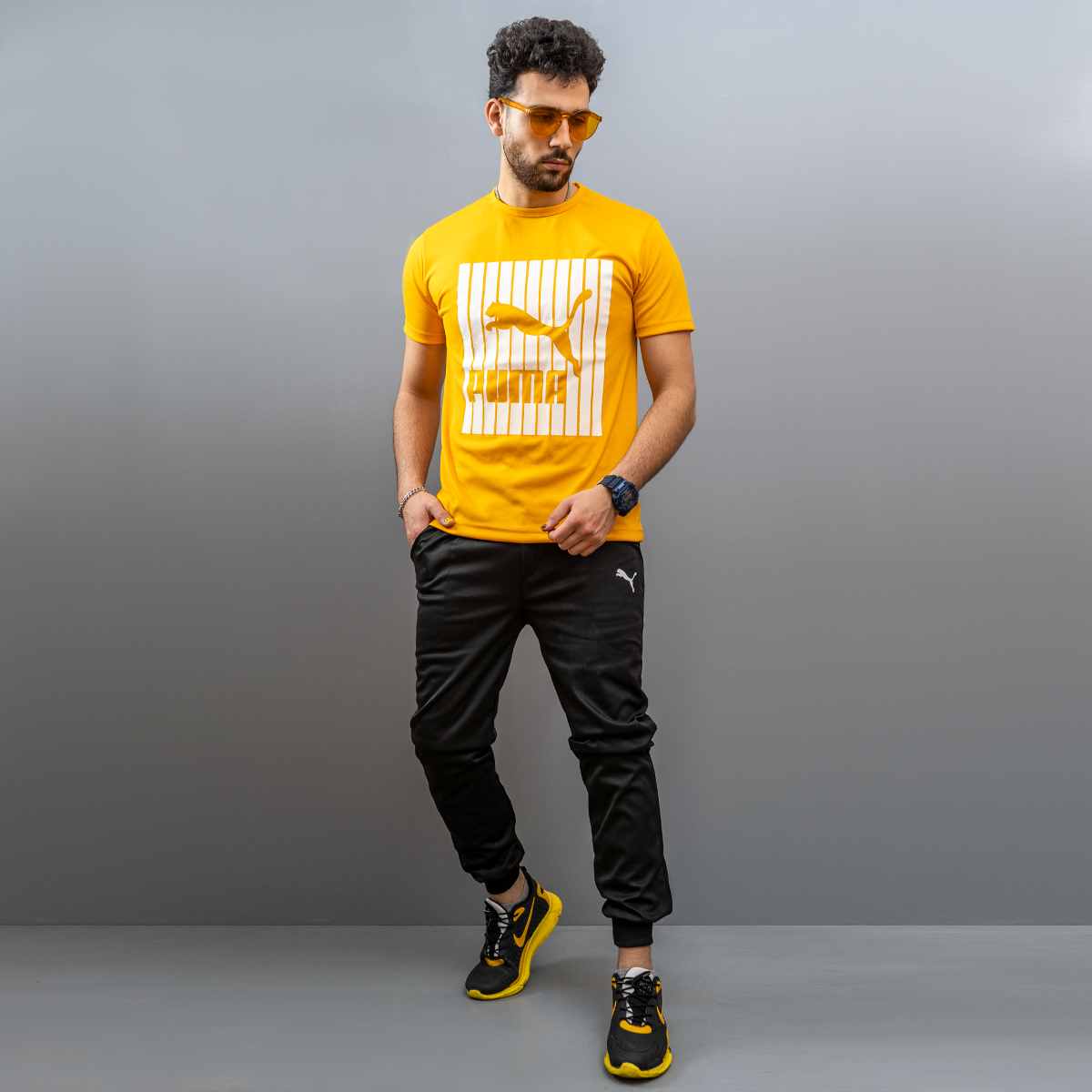 ست لباس ورزشی پسرانه تی شرت و شلوار اسلش زرد مشکی طرح Puma 2021